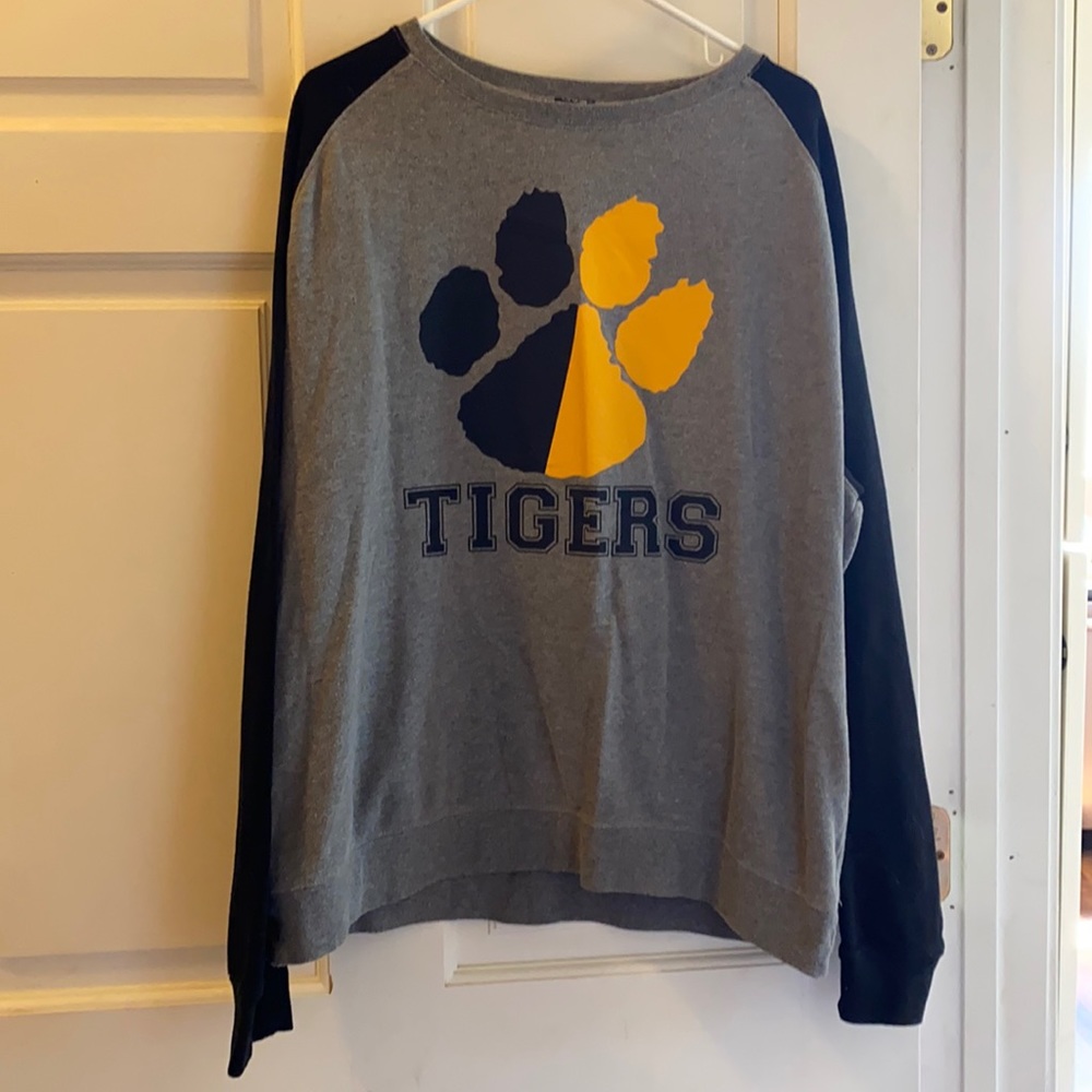 Tigers sweatshirt.  half black half yellow paw.